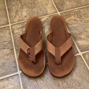 Tan rainbow flip flops